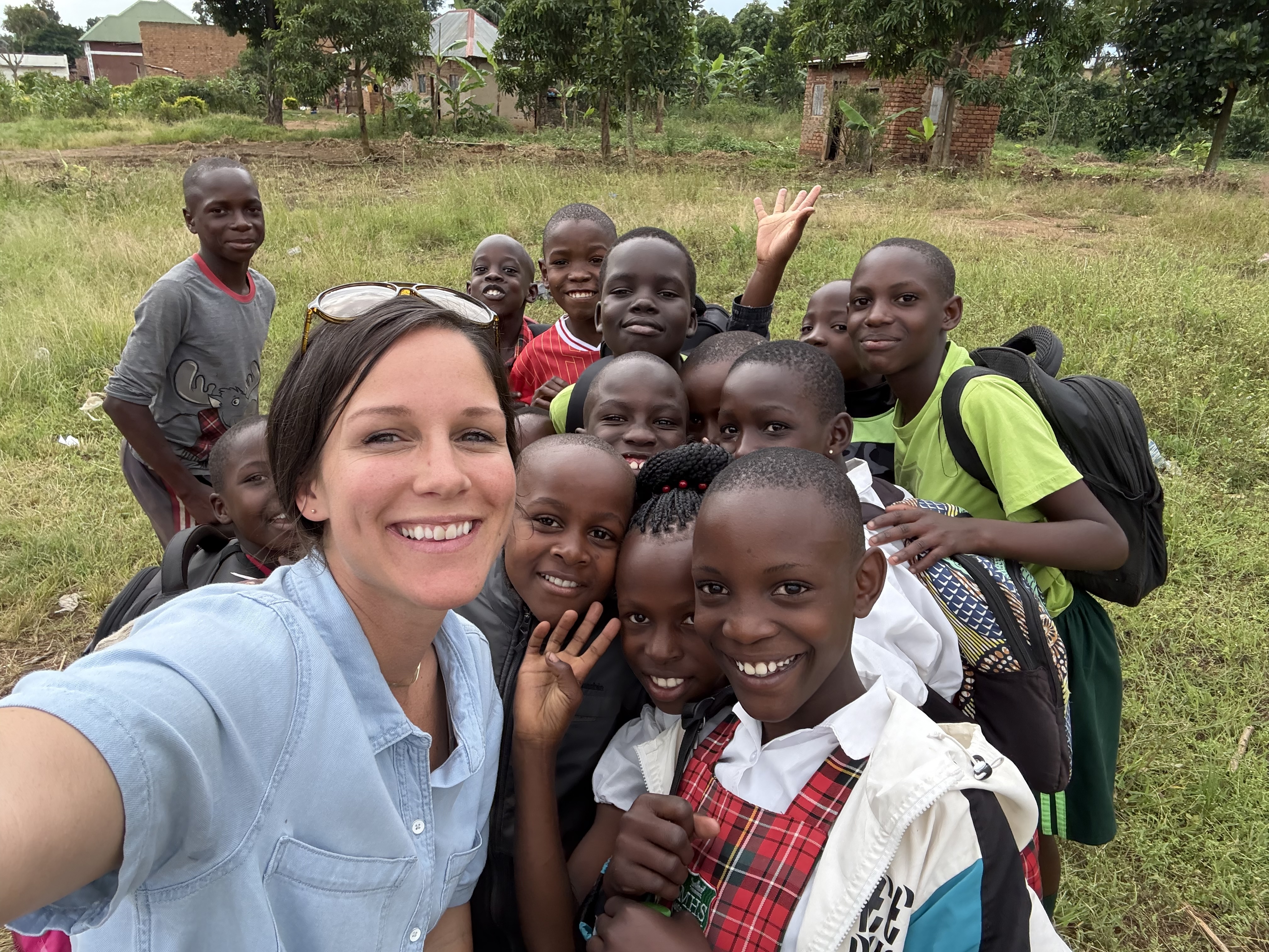 Tara with a group of children in a rural Ugandan village